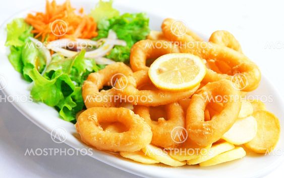 Deep batter fried squid rings calamari with green salad