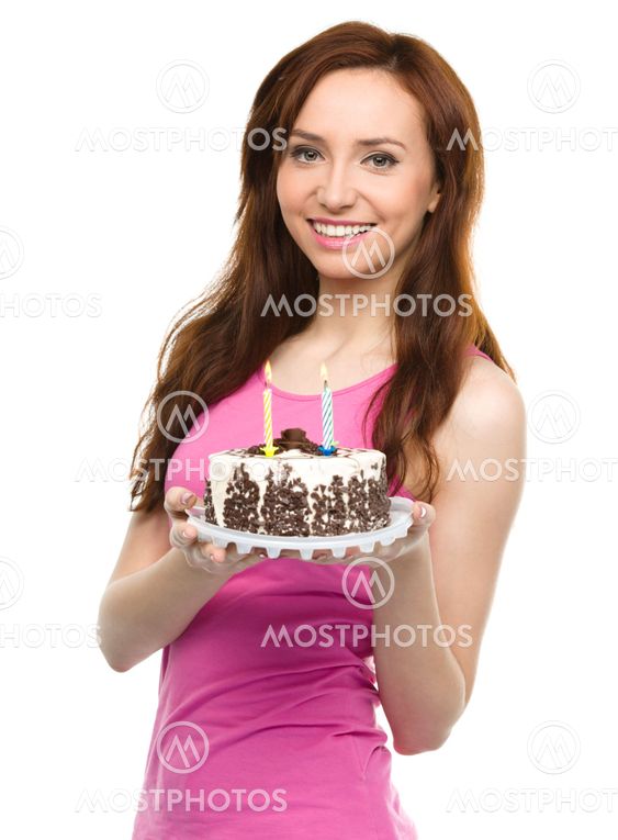Young woman with anniversary cake