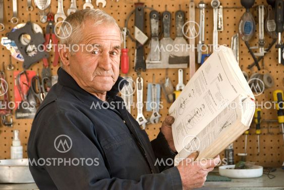 Older Mechanic Reading