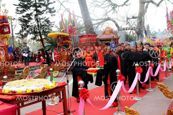 Group of people give gifts to the holy