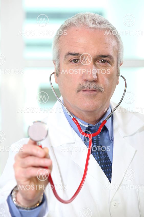 Doctor holding up the chestpiece of his stethoscope