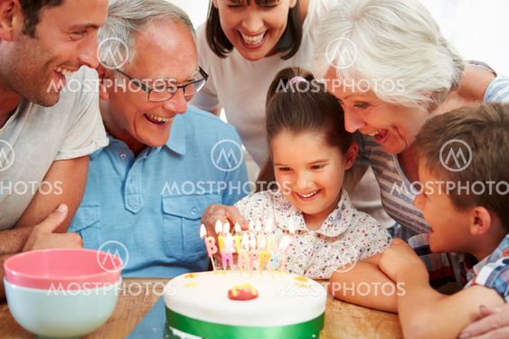 Multi Generation Family Celebrating Daughter's Birthday