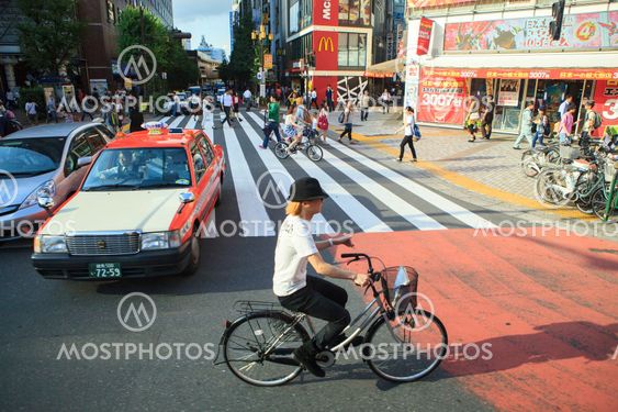 TOKYO JAPAN-SEPTEMBER 11 : japanese walking on urban street in heart of tokyo on september 11, 2015 in Tokyo Japan