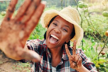 Portrait, dirty hands and black woman in garden, peace...