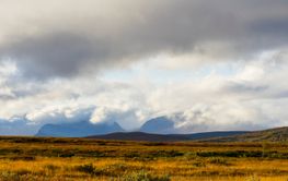 Clouds above mountain range landscape