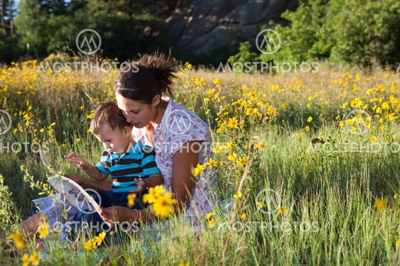 Mother and son reading a book together