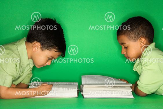 Boys lying and reading.