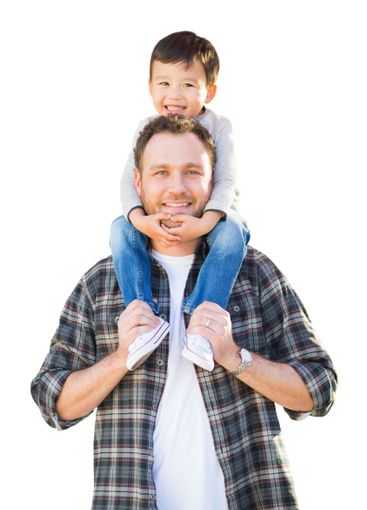 Happy Mixed Race Father and Son Riding Piggyback...