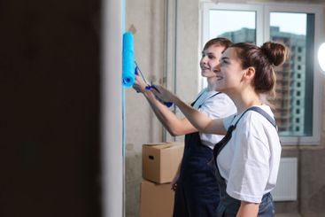 House decoration DIY renovation concept. Happy couple in...