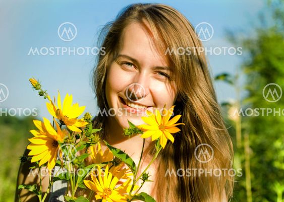 Young woman with yellow flowers