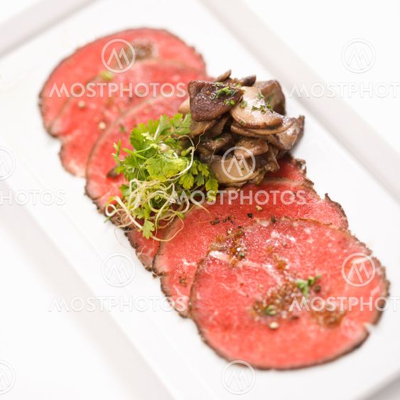 Beef carpaccio with mushrooms.