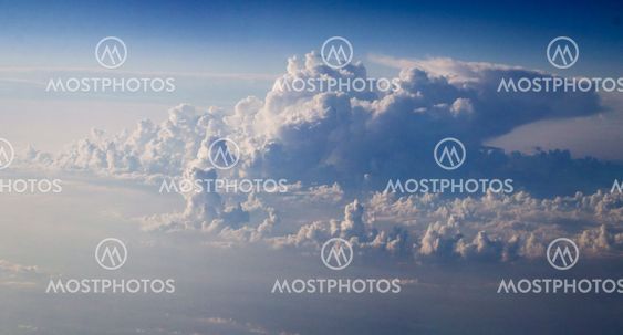 dramatic blue sky with clouds and sun rays