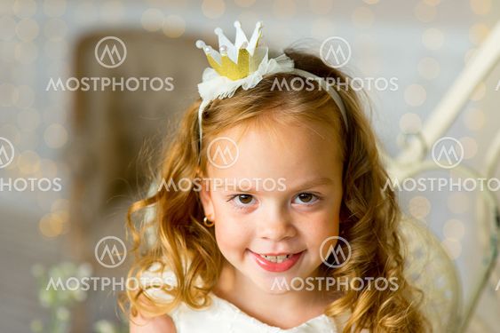 little princess sitting near the table