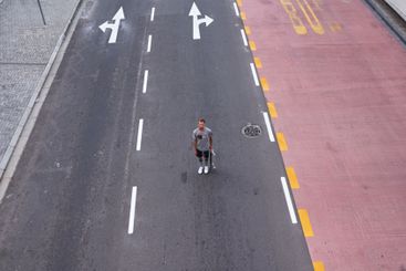 City, athlete and man with skateboard, road and...
