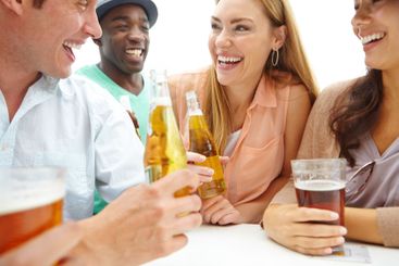 Beer, conversation and group of friends at pub together...