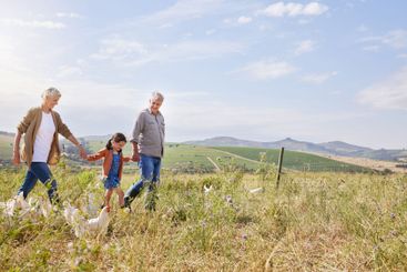 Family, holding hands and chicken at farm with child in...