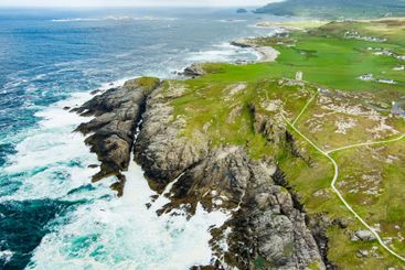 Rough and rocky shore at Malin Head, Ireland's...