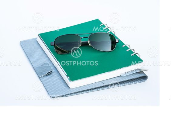 Sunglasses on a spiral notebook