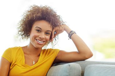 Portrait, relax and woman in house, joy and confident in...