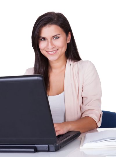 Woman sitting working at her laptop