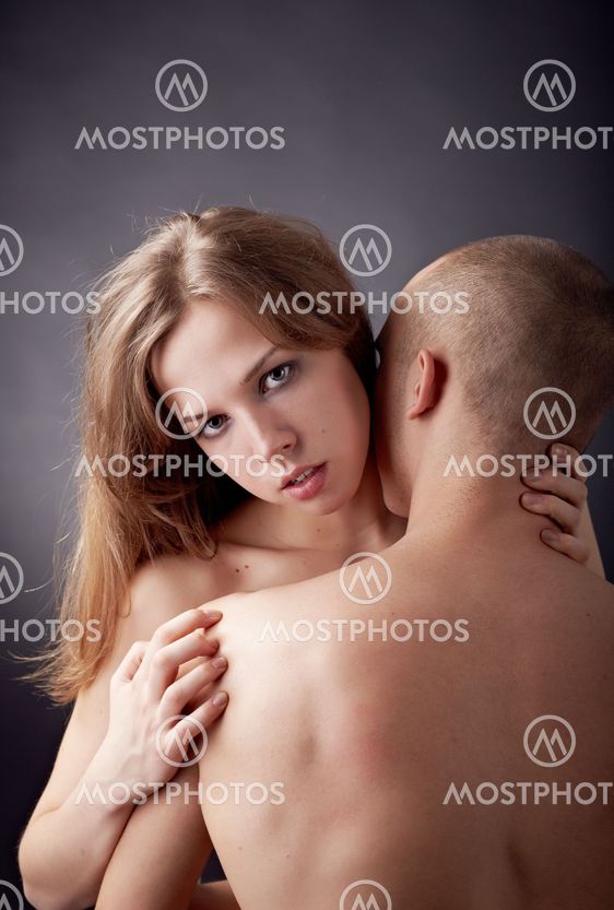 Muscular man and topless girl