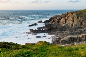 Rough and rocky shore at Malin Head, Ireland's...