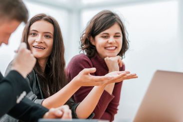 group of young people discussing online news