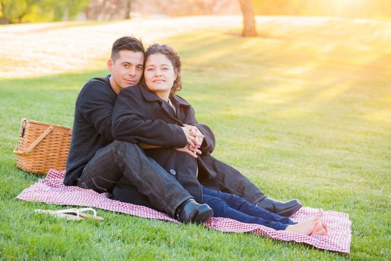 Hispanic Pregnant Young Couple Portrait Outdoors
