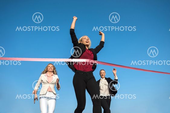 business people running on racing track