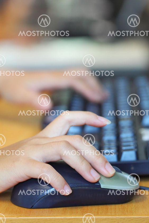 Human hands using computer