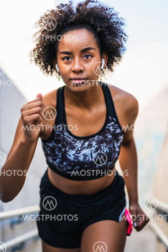 Afro athlete woman running outdoors.