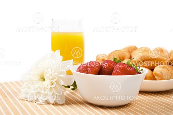 Breakfast with berries,orange juice and croissant