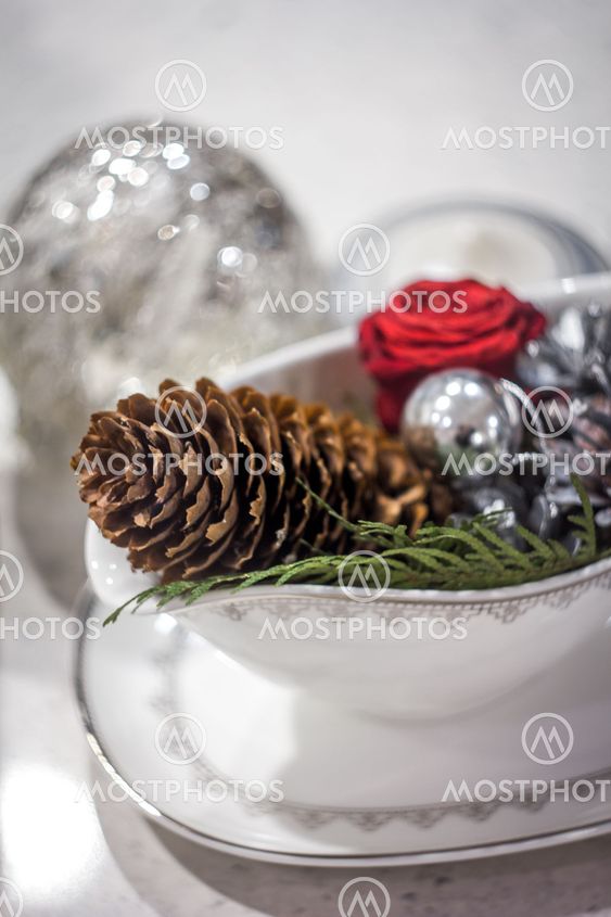 Pine cone and christmas tree decorations in a stew pan