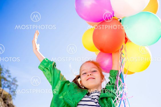 Girl is having fun with balloons