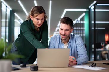 Business People Training On Computer. Young Woman