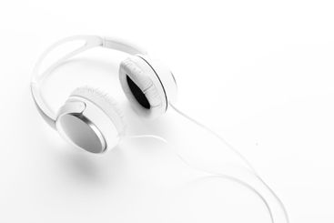 White headphones on white background close up