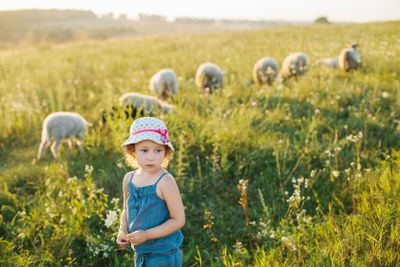 Portrait of a little girl walking in the field