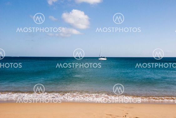 Sailing boat with beach