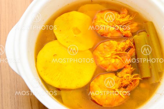 Sour and spicy shrimps curry with bamboo shoot and lotus...