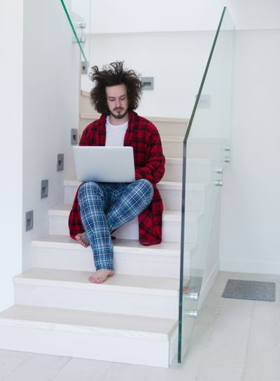 freelancer in bathrobe working from home