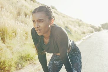 Fitness, running and tired with sports Indian woman...