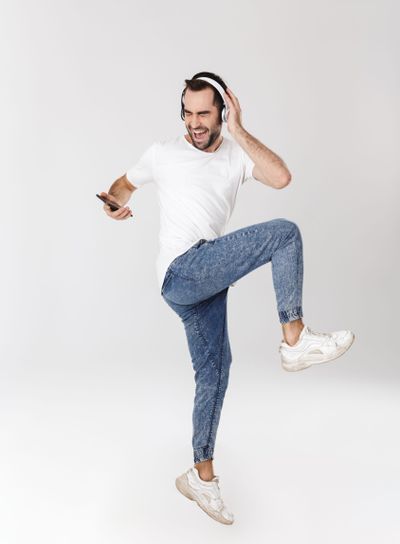 Full length of a handsome cheerful man