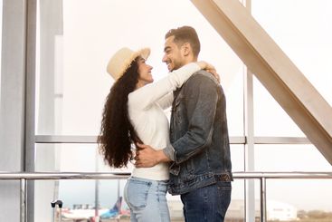 Romantic Arab Couple Hugging While Waiting For Flight In...