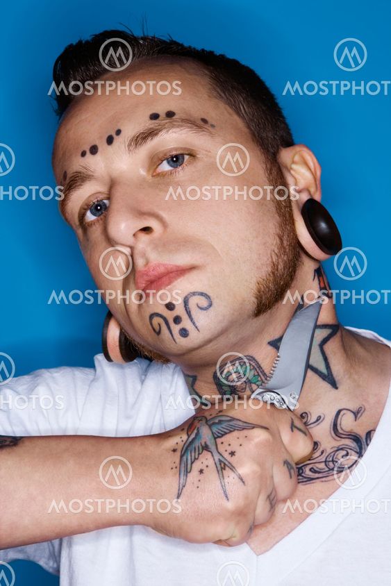 Man holding knife to throat.