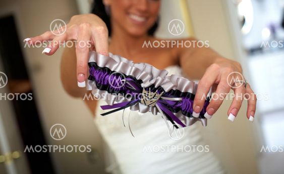 Bride dressing for the wedding ceremony
