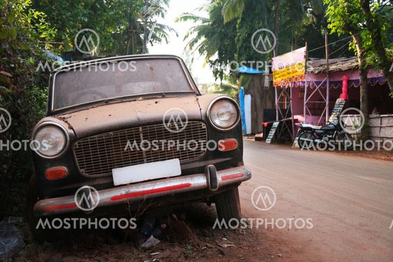 Dirty abandoned old-fashioned car