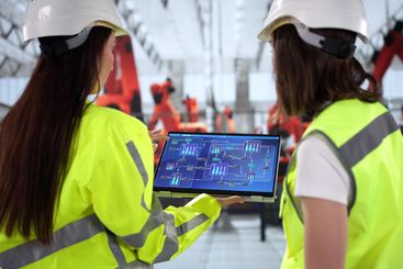 Young female technician inspects vehicle
