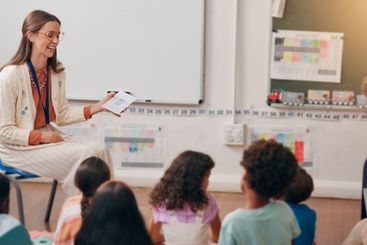 Teacher, kids and card in classroom with question, smile...