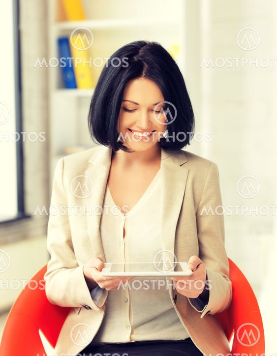 smiling businesswoman with tablet pc