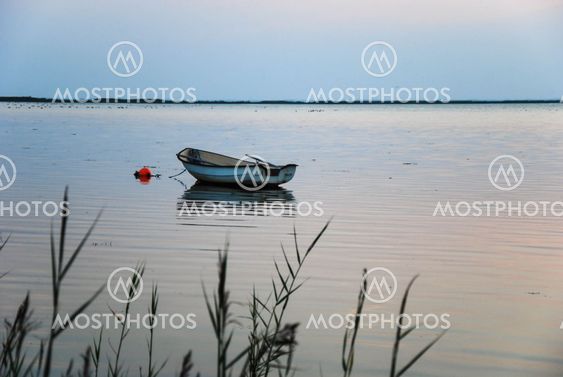 Anchored rowing boat at twilight